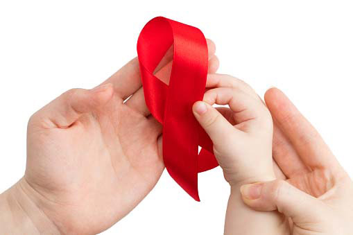 red ribbon on man, woman and child's hands